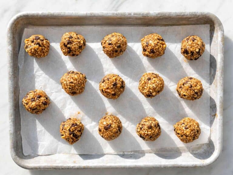 Step 3 Rolled chunky monkey energy balls on a baking tray.