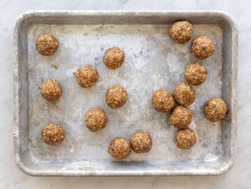 Step 3 Rolled energy balls on silver tray.