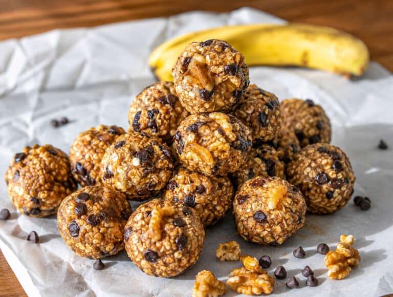 Step 4 Freshly shaped energy balls arranged on baking paper before chilling.