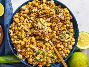 Step 4 Serving spoon lifting a portion of creamy corn salad.
