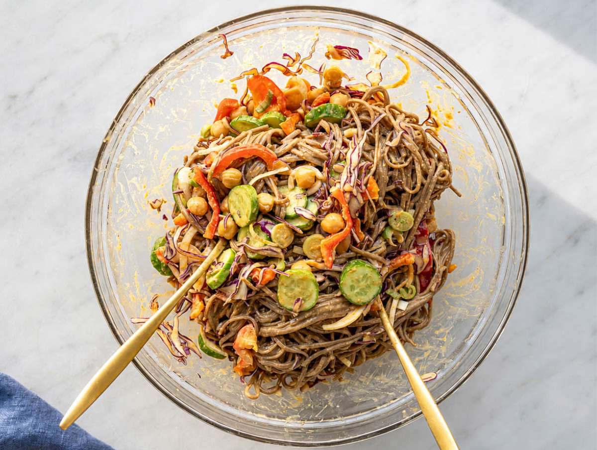 Step 4 Vegetables and chickpeas mixed into dressed soba noodles.