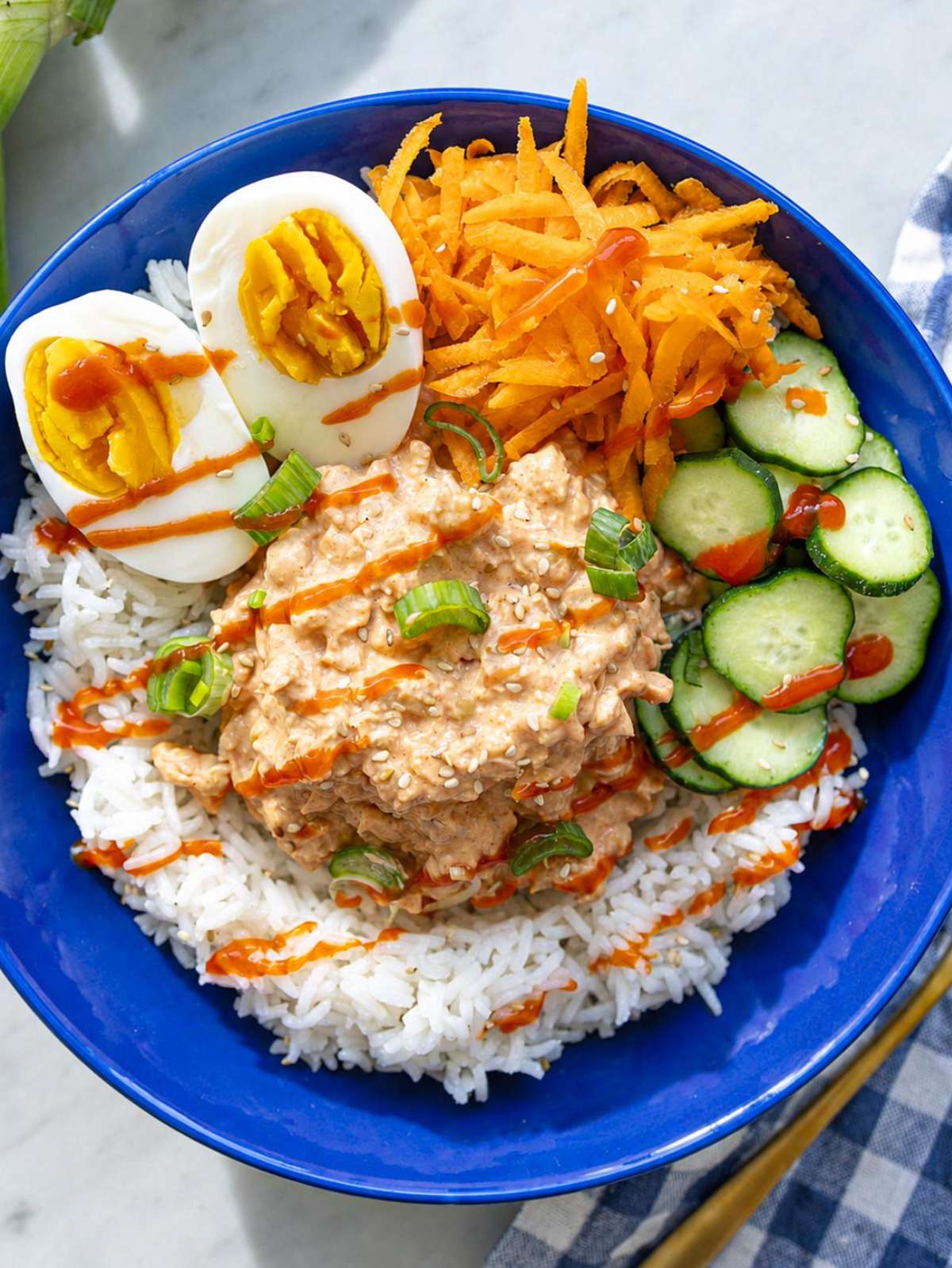 Yum Yum Chickpea Rice Bowl with eggs, cucumber, and carrots.