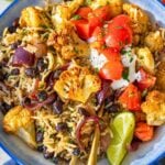 Cauliflower Burrito Bowl served warm with lime, herbs, and melted cheese.