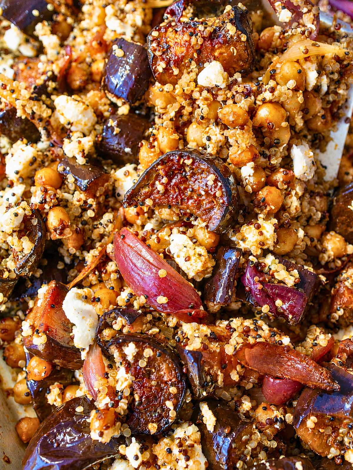 Close up of gyro bowl with eggplant, feta, quinoa, and caramelized onions.