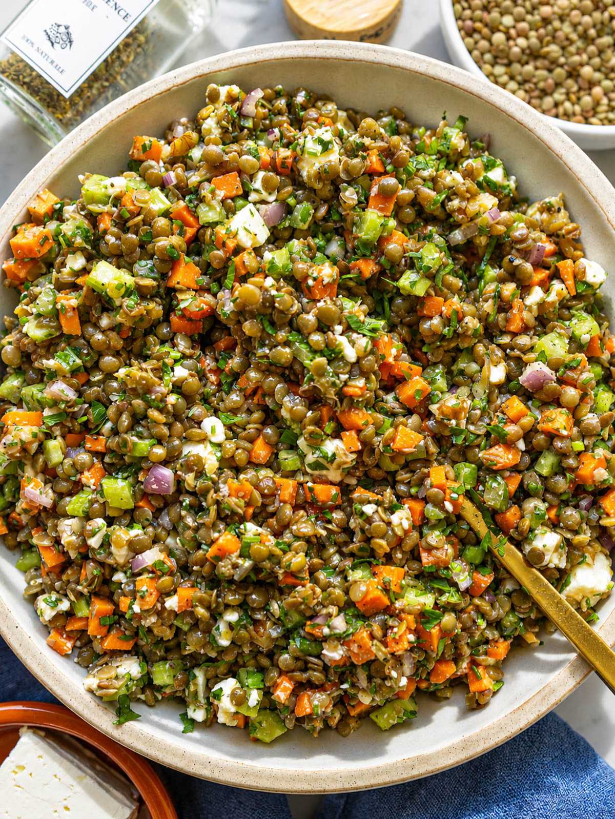 French lentil salad with feta, walnuts, and parsley in natural window light.