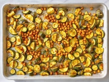 Step 1 Roasted zucchini and chickpeas browned and caramelized after baking on sheet pan.
