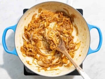 Step 1 Sliced onions caramelizing in olive oil until soft and golden.