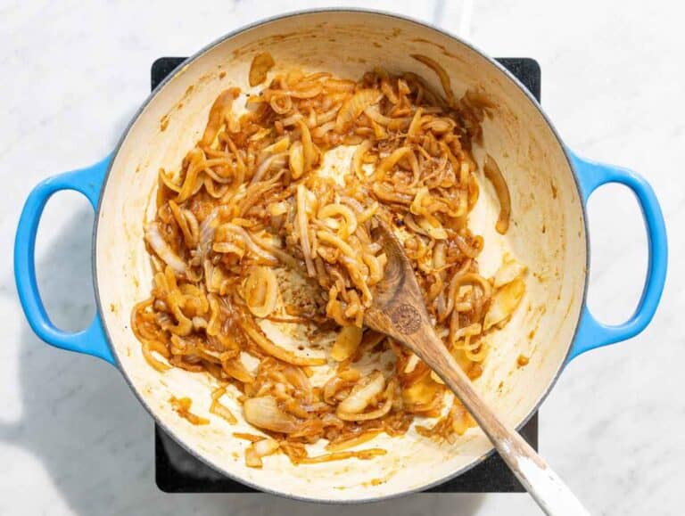 Step 1 Sliced onions caramelizing in olive oil until soft and golden.