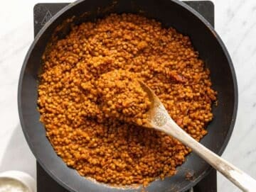 Step 1 Spiced lentil sauce cooked in a skillet.