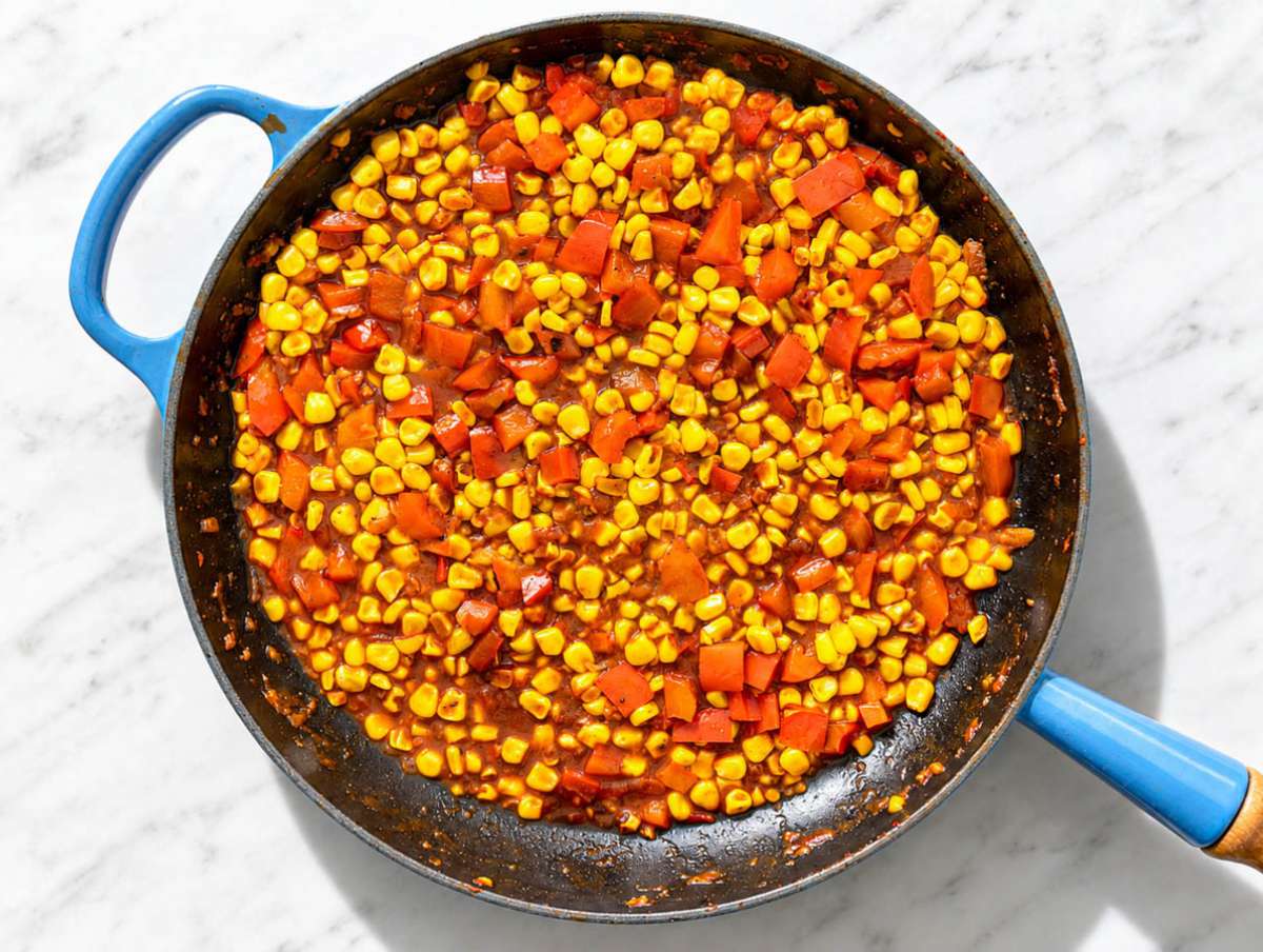 Step 2 Corn charring with smoked paprika, thyme, and seasonings in the skillet.