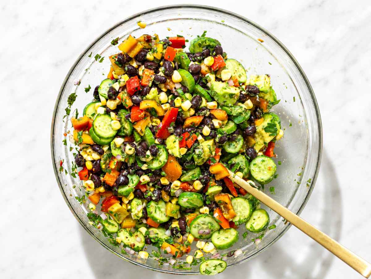 Step 2 Corn, cucumber, peppers, and onion tossed with marinated black beans.