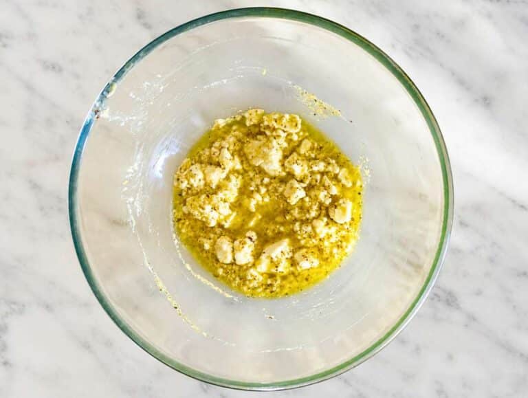 Step 2 Lemon dressing whisked with feta in a large mixing bowl.