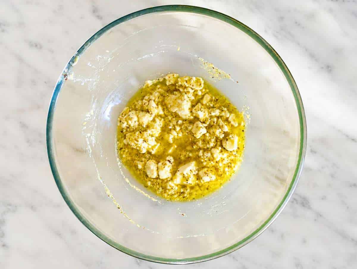 Step 2 Lemon dressing whisked with feta in a large mixing bowl.