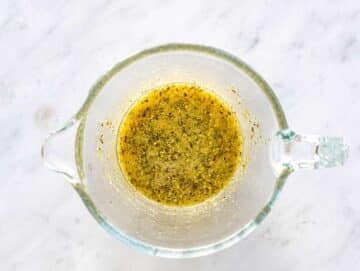 Step 2 Lime dressing with dried herbs on marble surface.