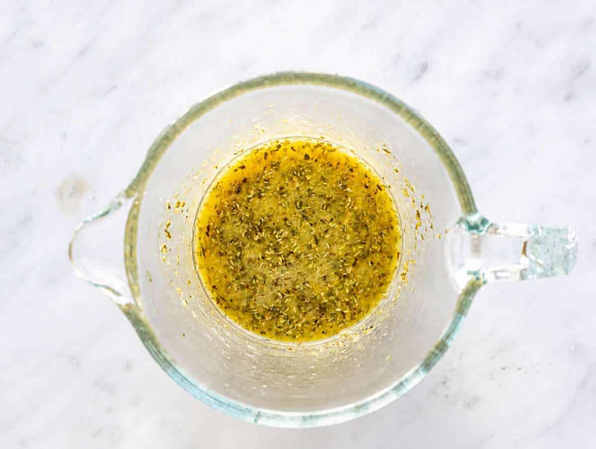 Step 2 Lime dressing with dried herbs on marble surface.