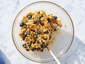 Step 2 Mixing oats, walnuts, chia seeds, blueberries, and remaining ingredients into dough.