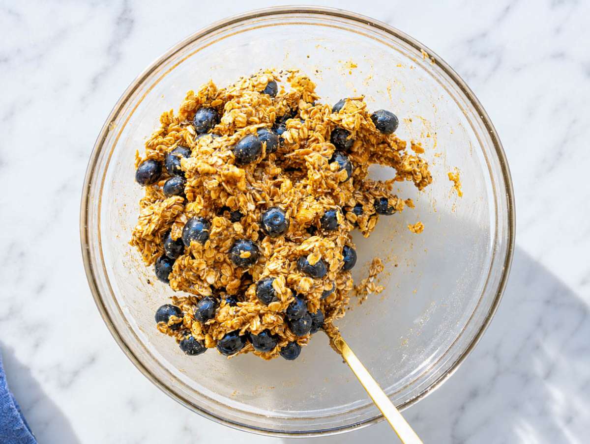 Step 2 Mixing oats, walnuts, chia seeds, blueberries, and remaining ingredients into dough.