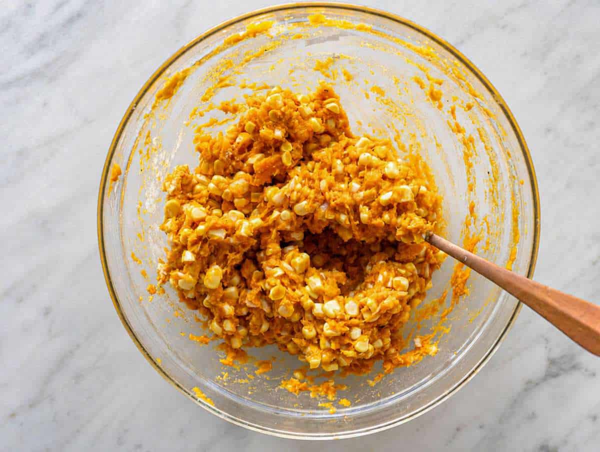 Step 2 Mixing sweet potato, corn, Parmesan, egg, flour, and spices together.