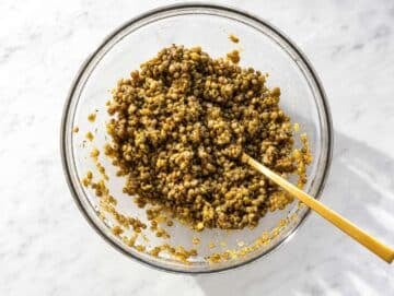 Step 2 Warm lentils tossed with glossy Dijon vinaigrette in a large mixing bowl.