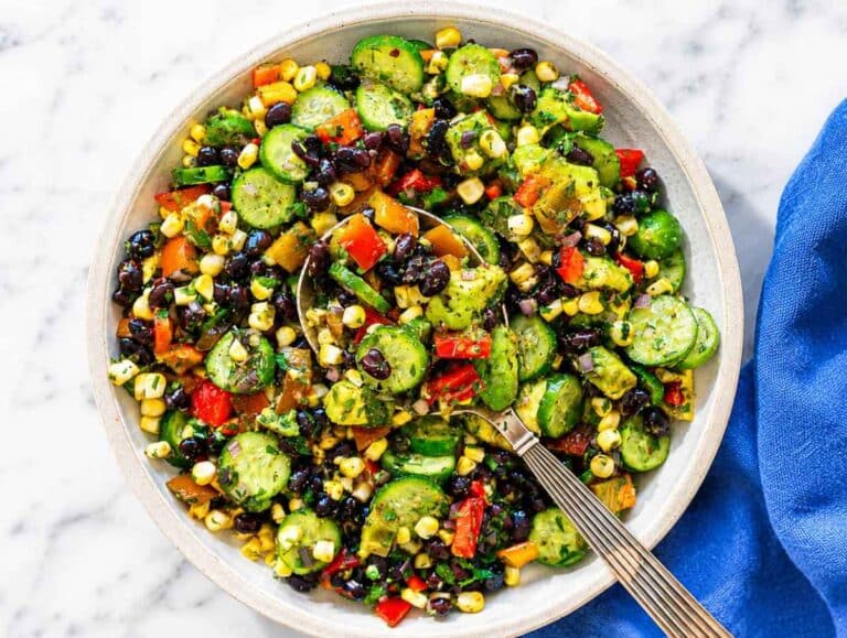 Step 3 Avocado folded into finished salad before serving in bright natural daylight.