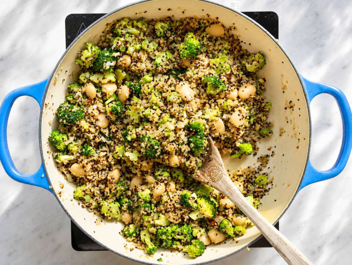 Step 3 Butter beans and broccoli folded into quinoa with simmering vegetable broth.