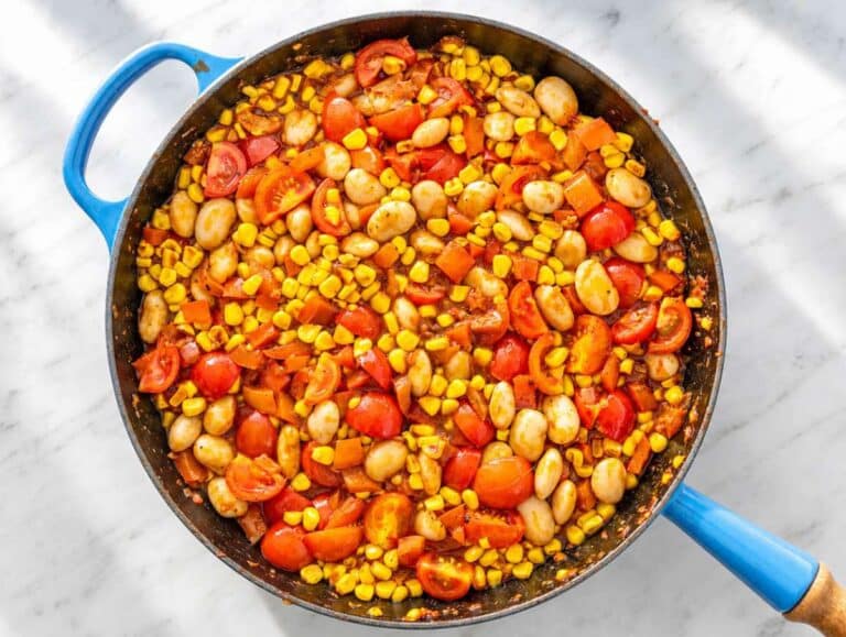 Step 3 Butter beans and tomatoes simmering in a lightly saucy vegetable broth.