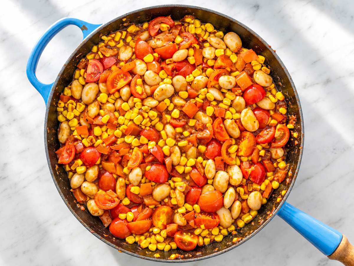 Step 3 Butter beans and tomatoes simmering in a lightly saucy vegetable broth.