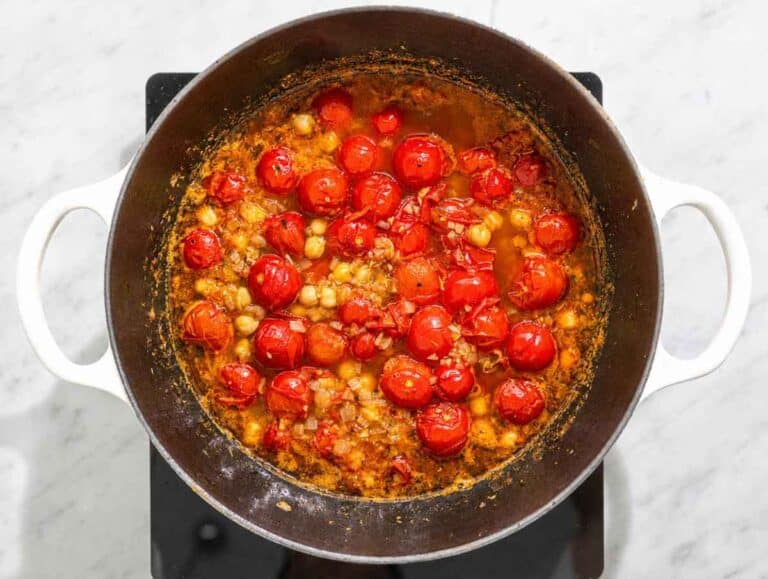 Step 3 Chickpeas simmering in tomato broth until rich and slightly creamy.