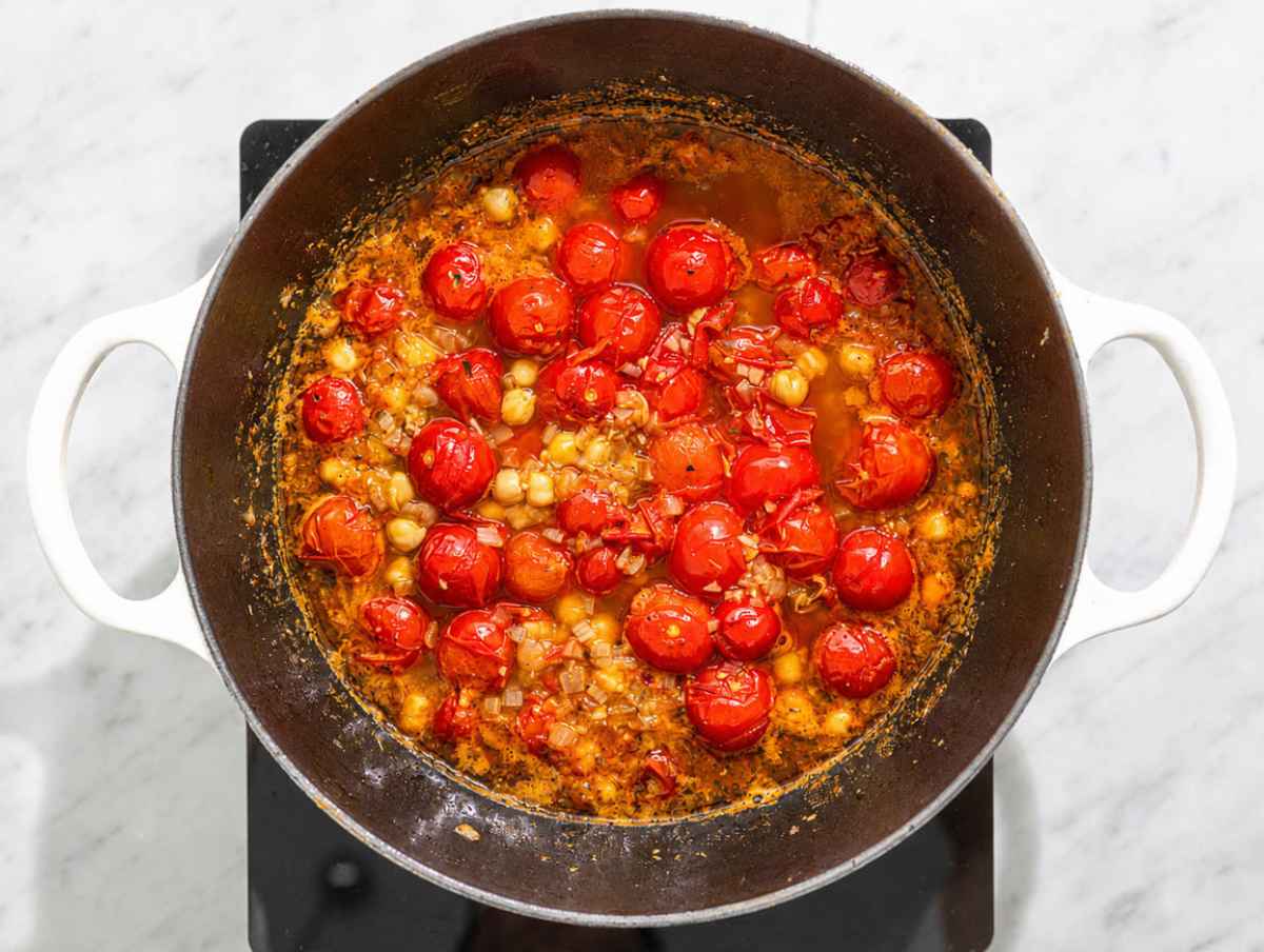 Step 3 Chickpeas simmering in tomato broth until rich and slightly creamy.