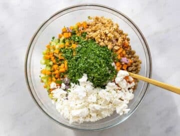 Step 3 Chopped vegetables, feta, parsley, and walnuts added to marinated lentils.