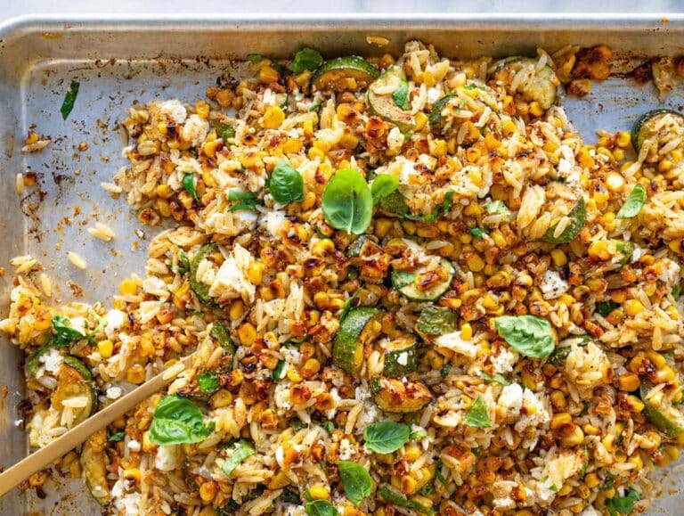 Step 3 Hot orzo tossed with roasted vegetables, feta, basil, and lime dressing.