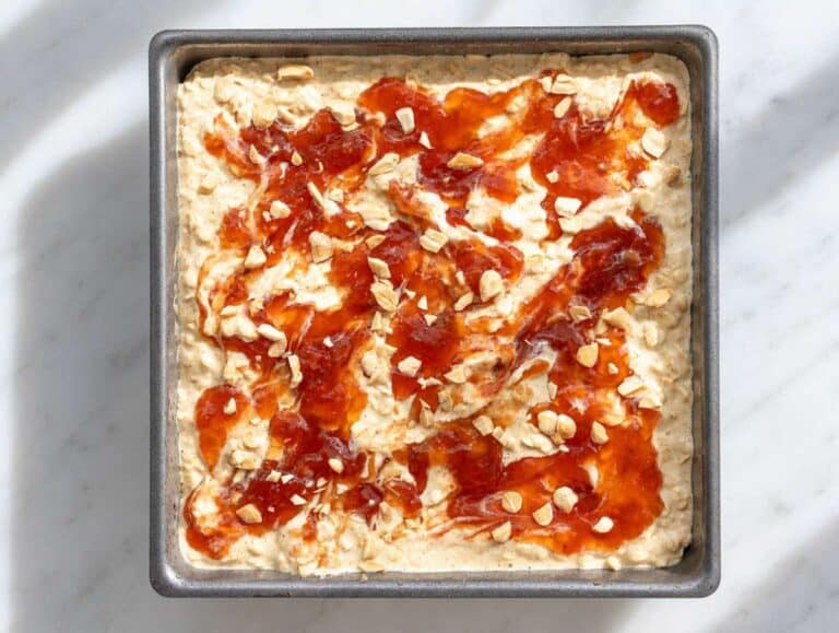 Step 3 Strawberry jam swirled through oatmeal and topped with chopped roasted peanuts.