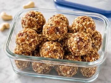 Step 4 Freshly rolled energy balls in airtight container ready to chill.