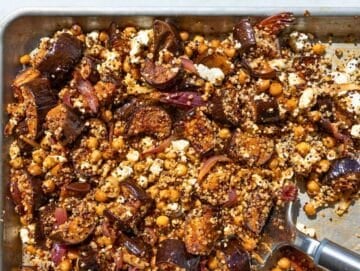 Step 4 Quinoa, feta, and lemon tossed with hot roasted vegetables on the baking sheet.