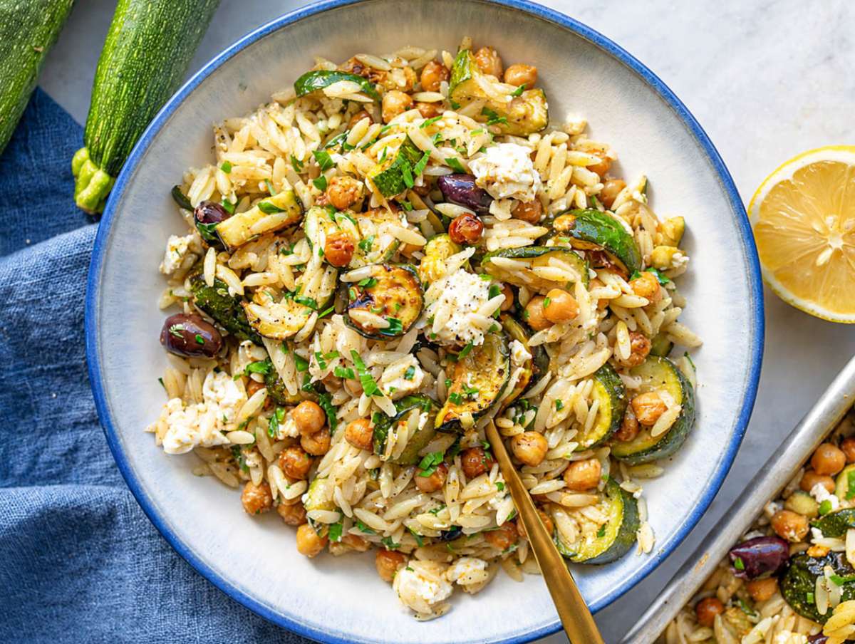 Step 4 Roasted zucchini orzo finished with parsley, feta, and fresh lemon before serving.