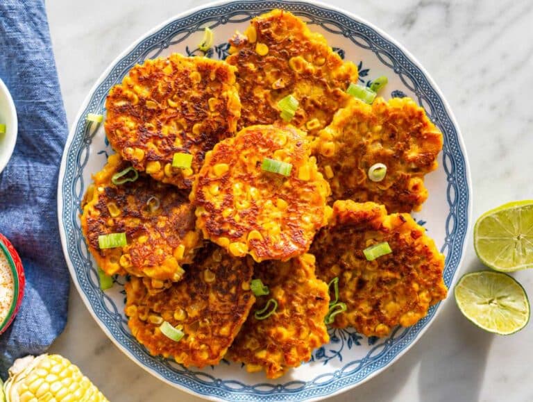 Step 4 Sweet potato corn patties served with lime and green onion.