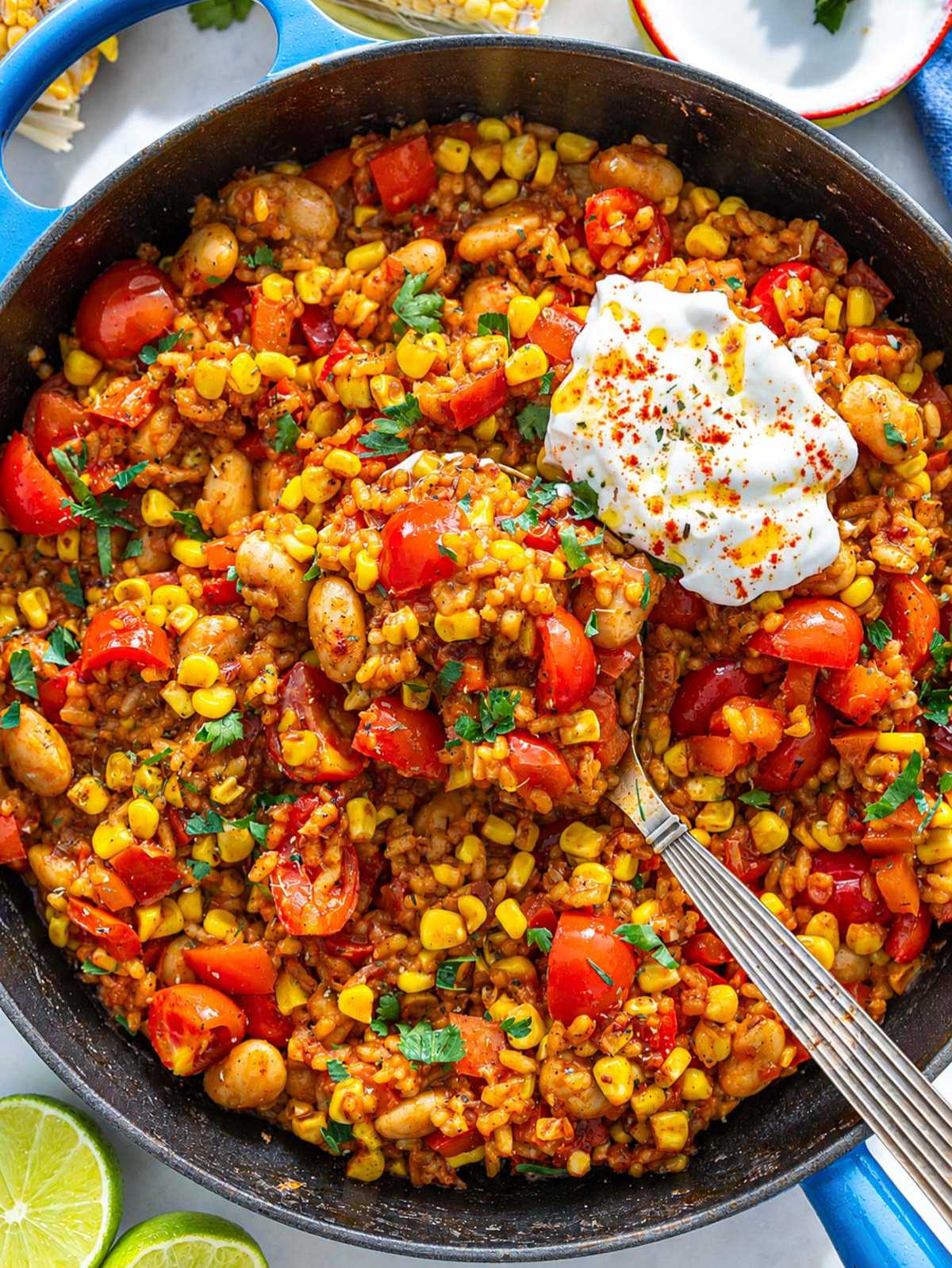 Summer succotash rice bowl with butter beans, corn, tomatoes, and fluffy rice.