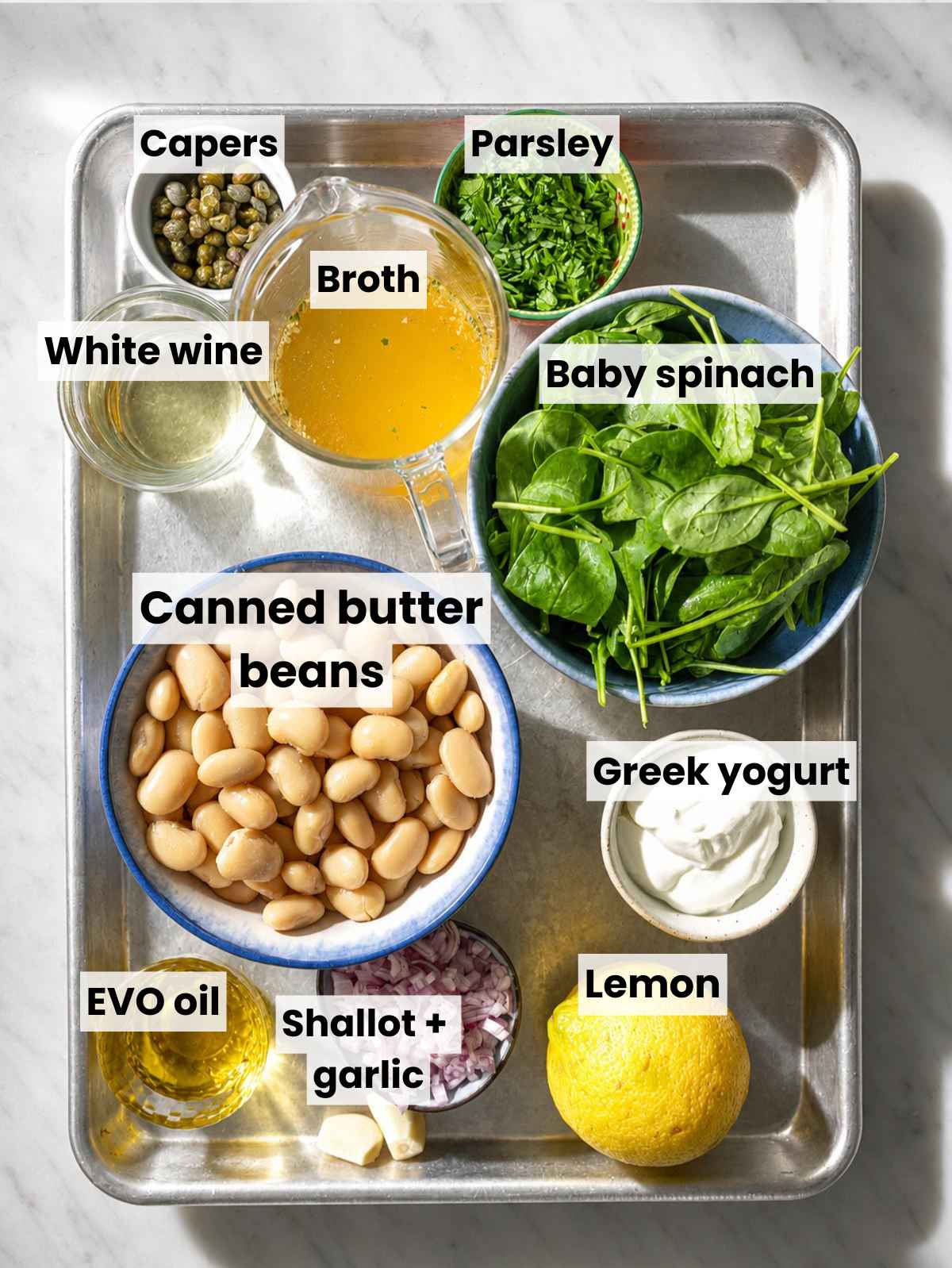 Butter beans, spinach, lemon, capers, shallot, garlic, yogurt, and broth.