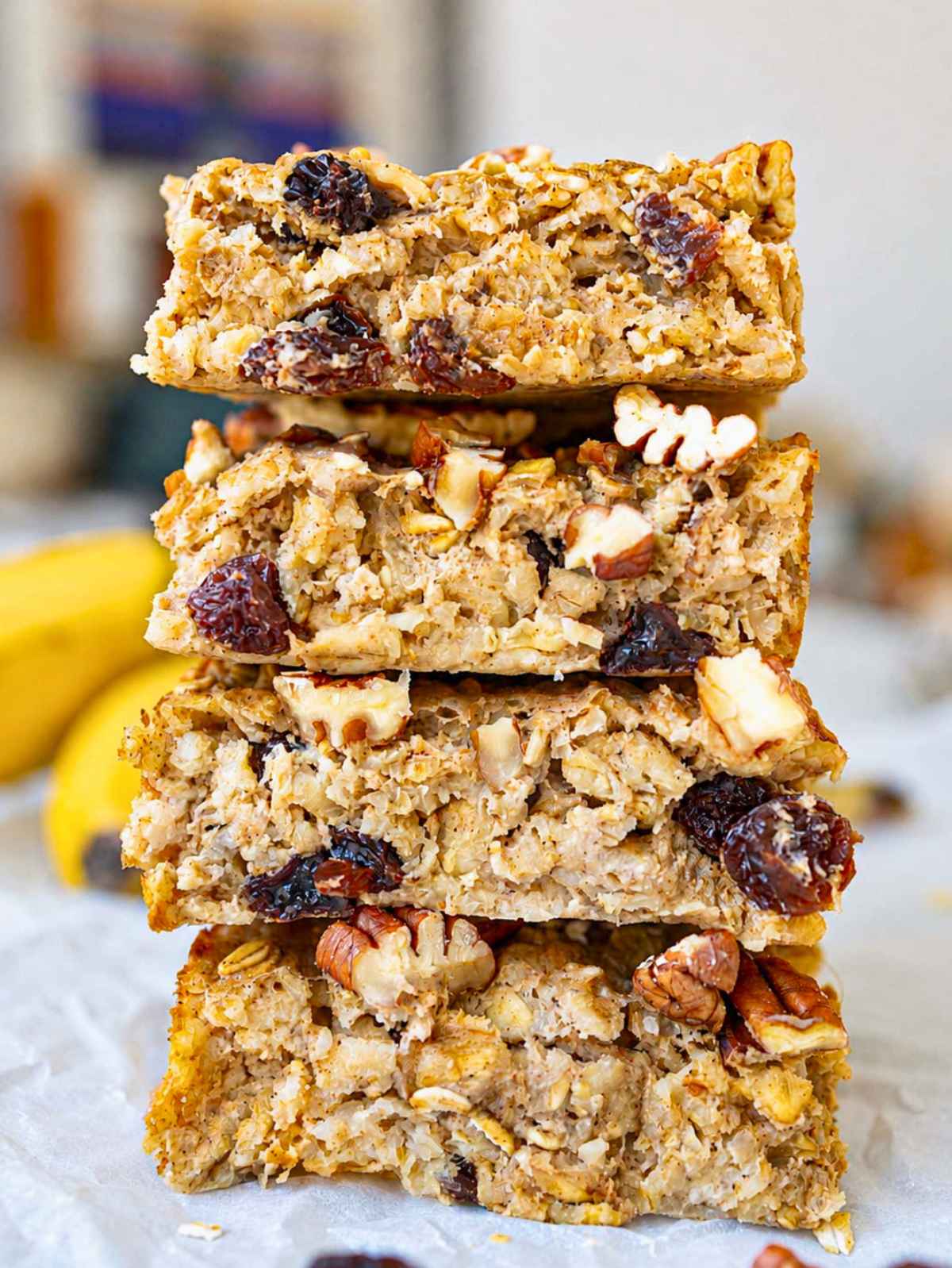 Close-up of creamy oatmeal raisin baked oatmeal with juicy raisins and crunchy pecans.