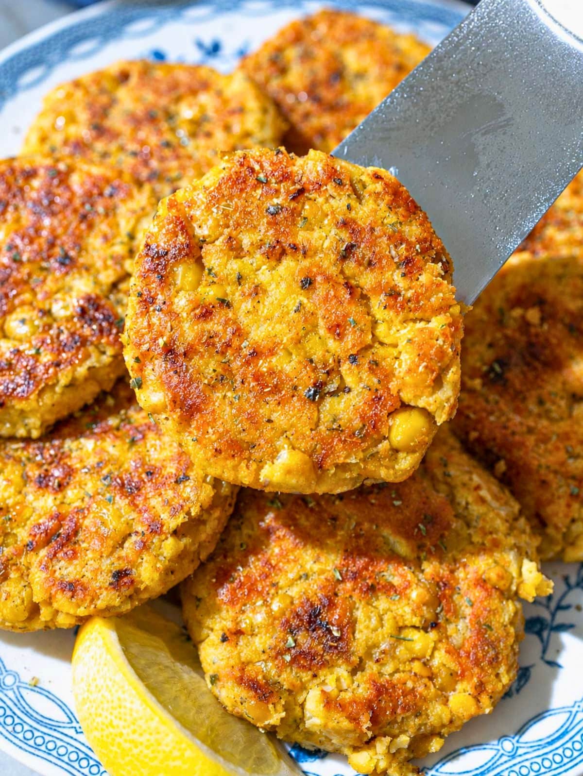 Close-up of crispy chickpea potato patties showing their tender, textured exterior.