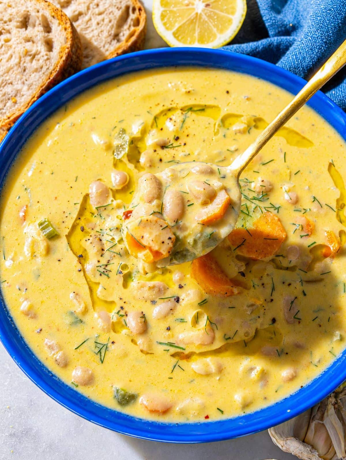 Creamy Lemon White Bean Soup with dill and olive oil drizzle.