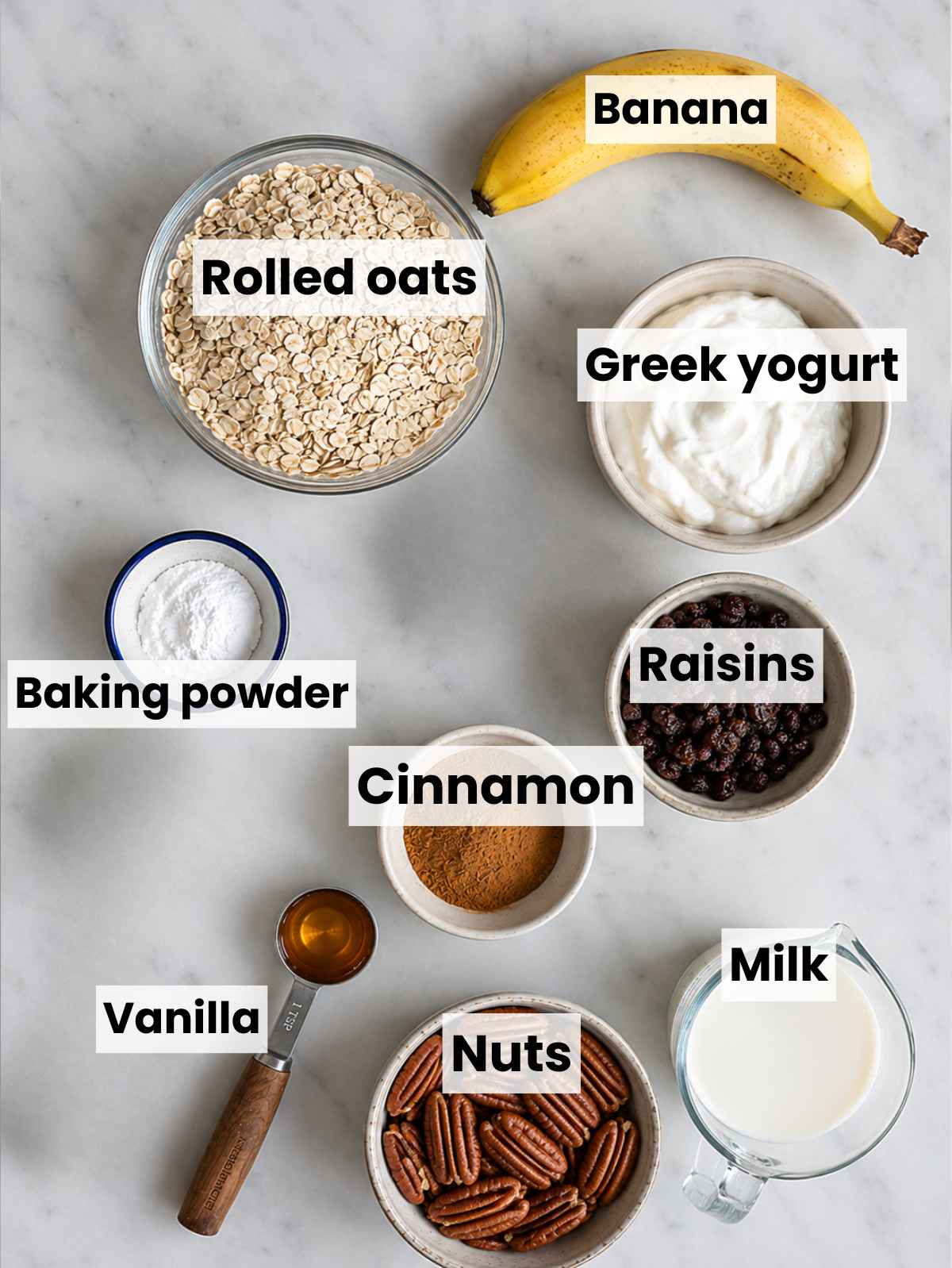 Oatmeal raisin baked oatmeal ingredients on white marble in bright natural window light.