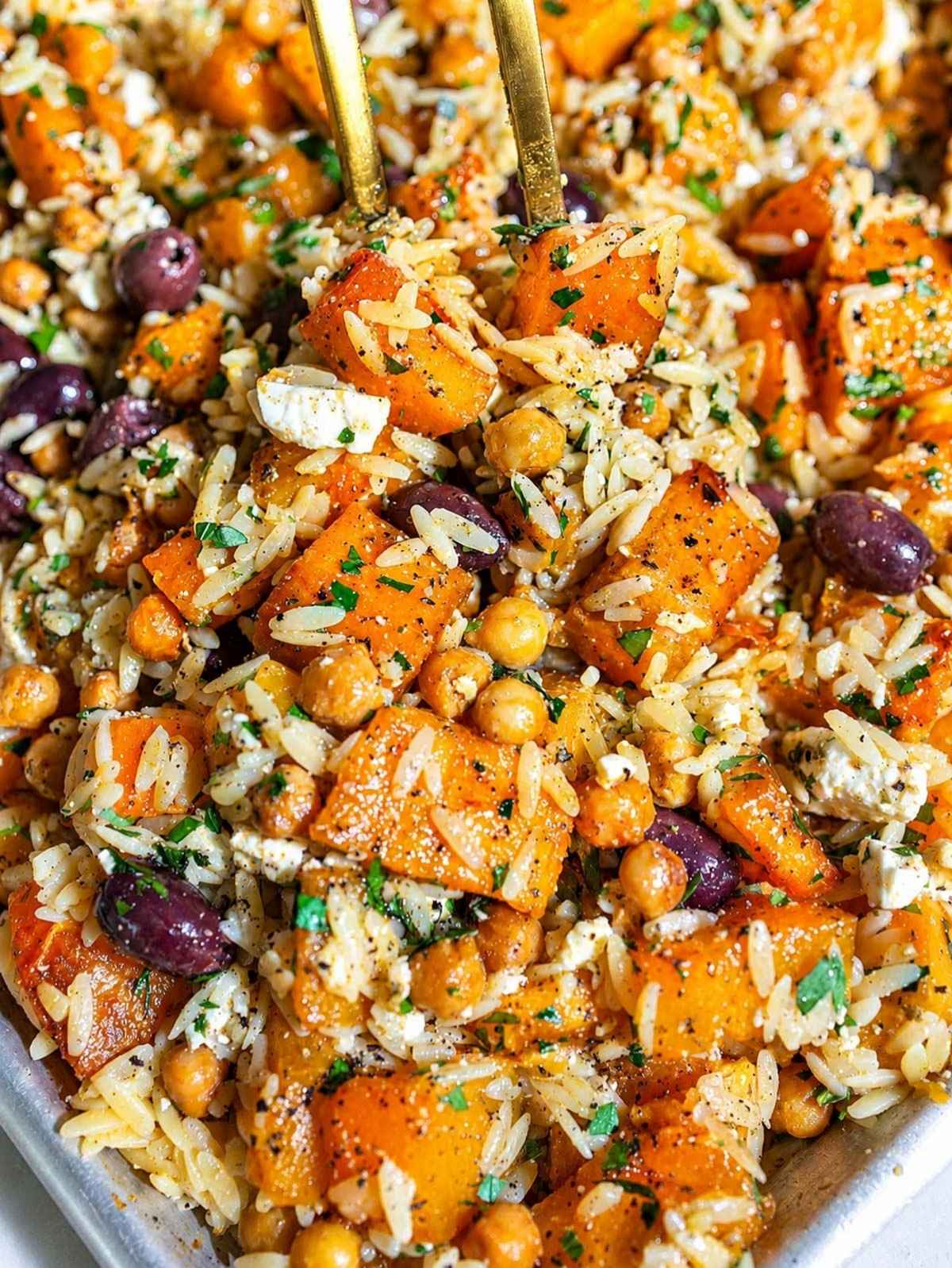 Roasted Butternut Squash Orzo with chickpeas, feta, olives, and parsley.