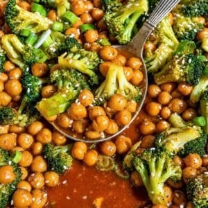 Sesame chickpeas and broccoli stir fry served with sesame seeds.