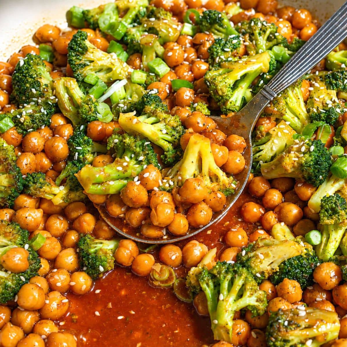 Sesame chickpeas and broccoli stir fry served with sesame seeds and scallions