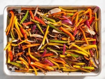 Step 1 Black beans, peppers, onions, spices, and tomato paste tossed on sheet pan.