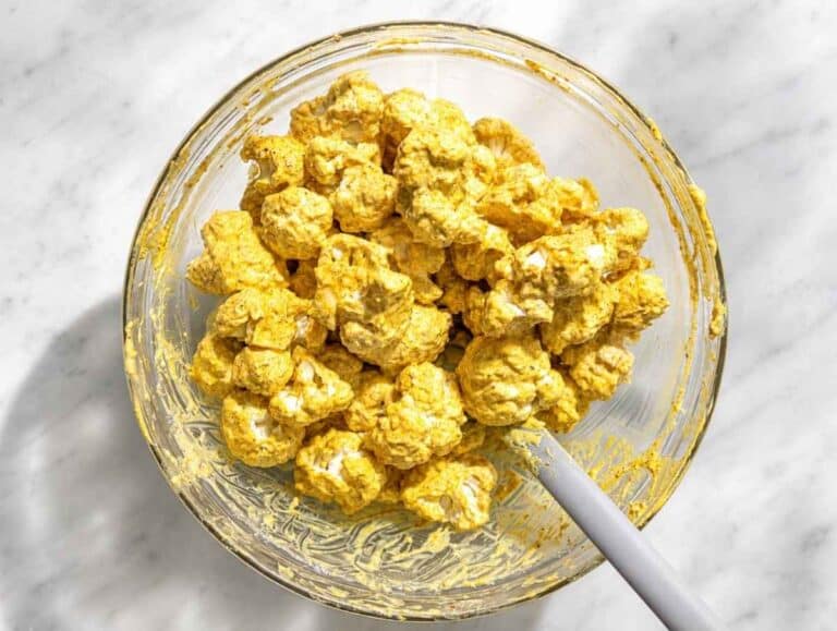 Step 1 Cauliflower florets coated with Greek yogurt, garlic, ginger, and warm spices.