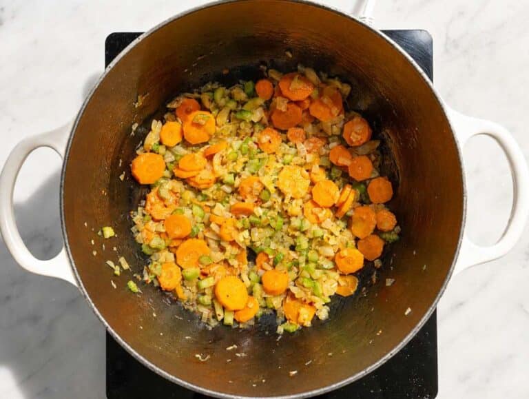 Step 1 Onion, carrots, and celery sautéing with garlic in olive oil.