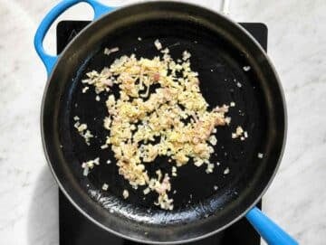 Step 1 Shallot and garlic softening in olive oil in a skillet.