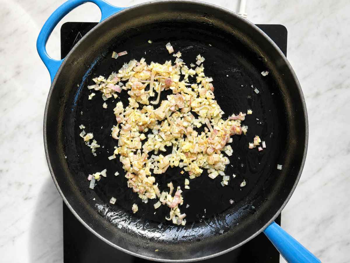 Step 1 Shallot and garlic softening in olive oil in a skillet.